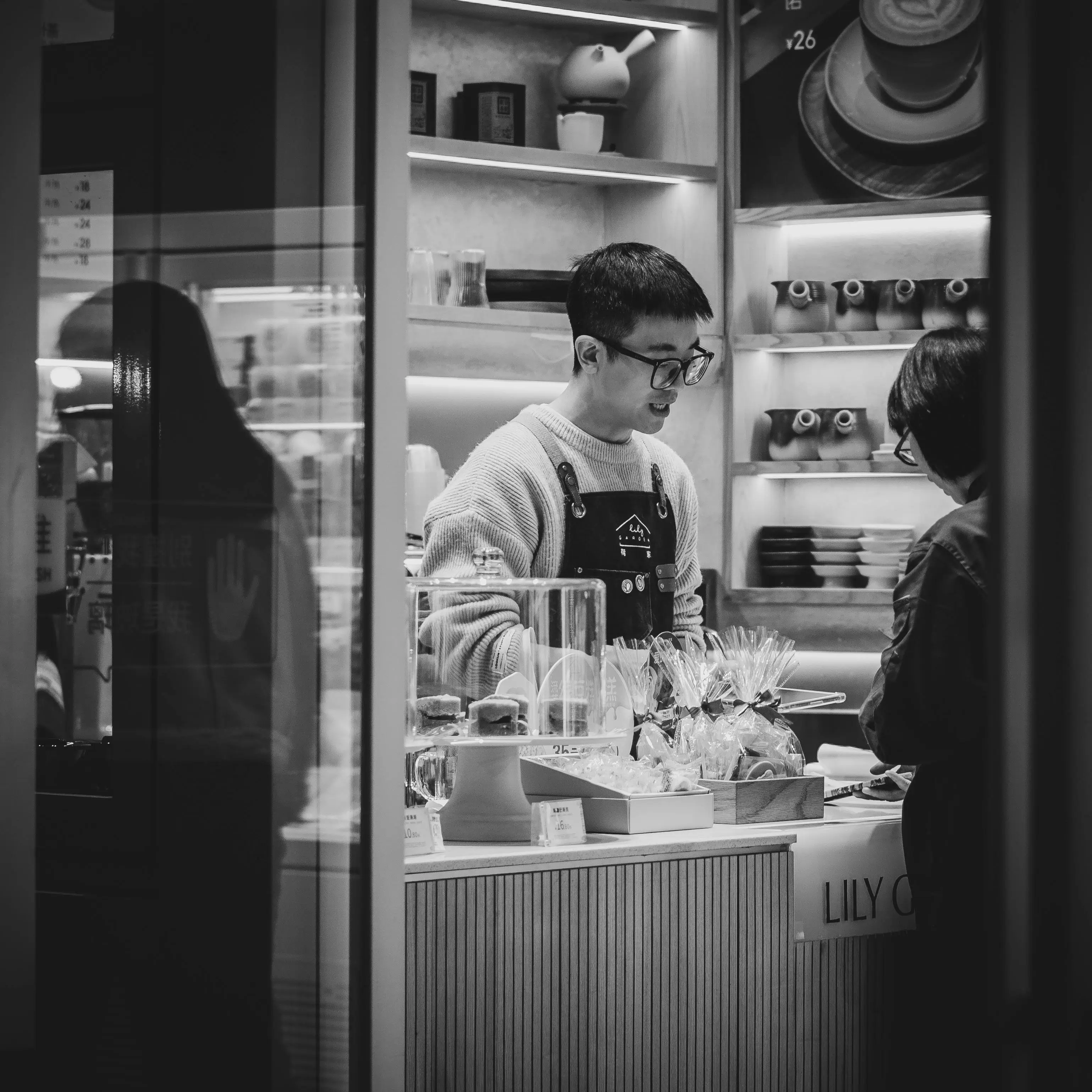 Clerk Working at Store with Ceramics